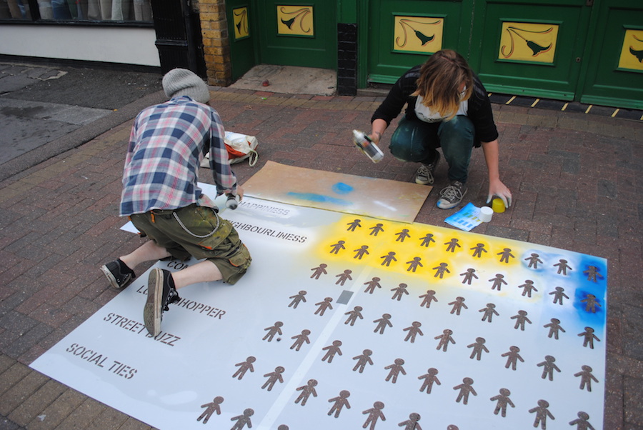 Visualisation being sprayed onto pavement of participating shop